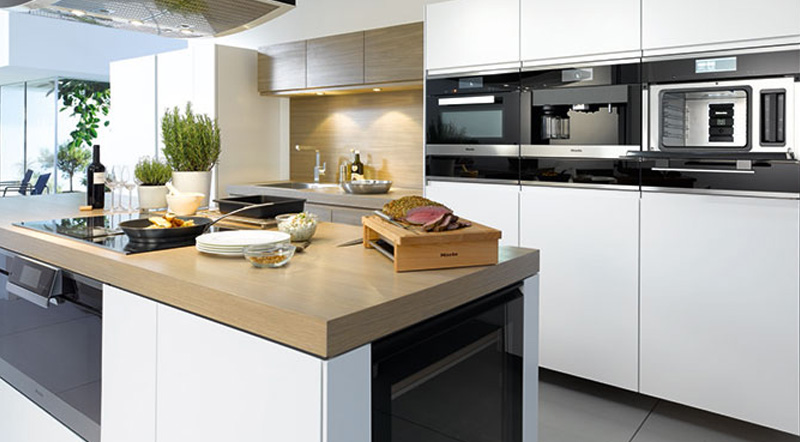 Light kitchen interior with integrated appliances