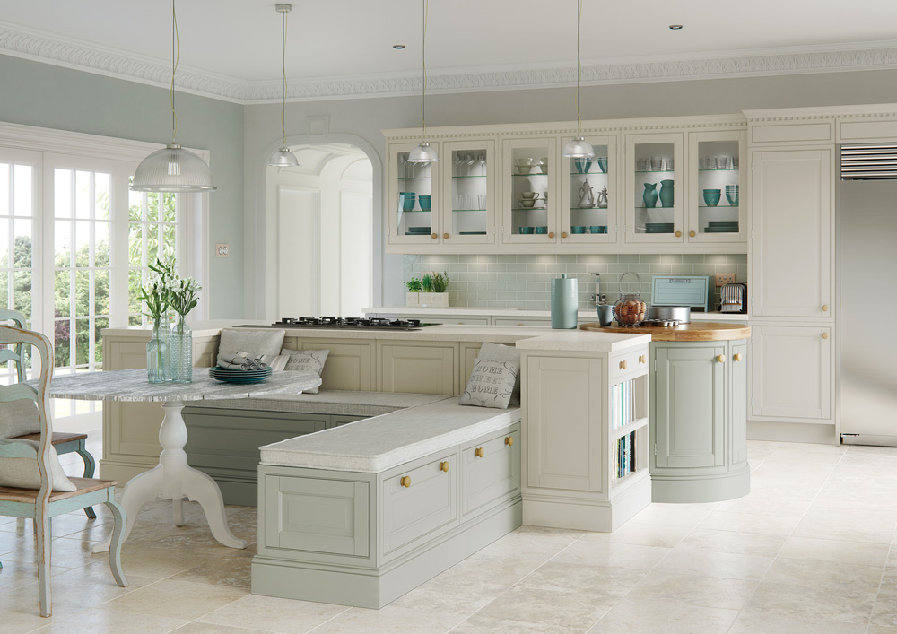 Pale framed kitchen cabinetry with a curved island and built-in seating. Do not describe concealed storage that the photograph does not show.